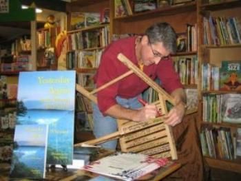 Steve signs one of the famous authors' chairs.  Thank you Mary Gay!  Also Sandra Tennyson with the local paper and Connie with KLCN..